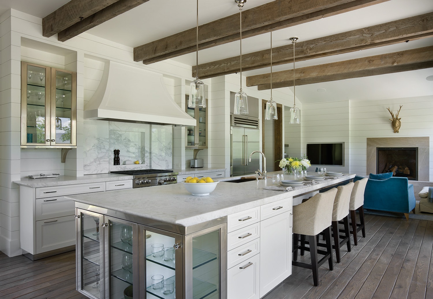 The glass and stainless steel accents give the kitchen a modern flair.