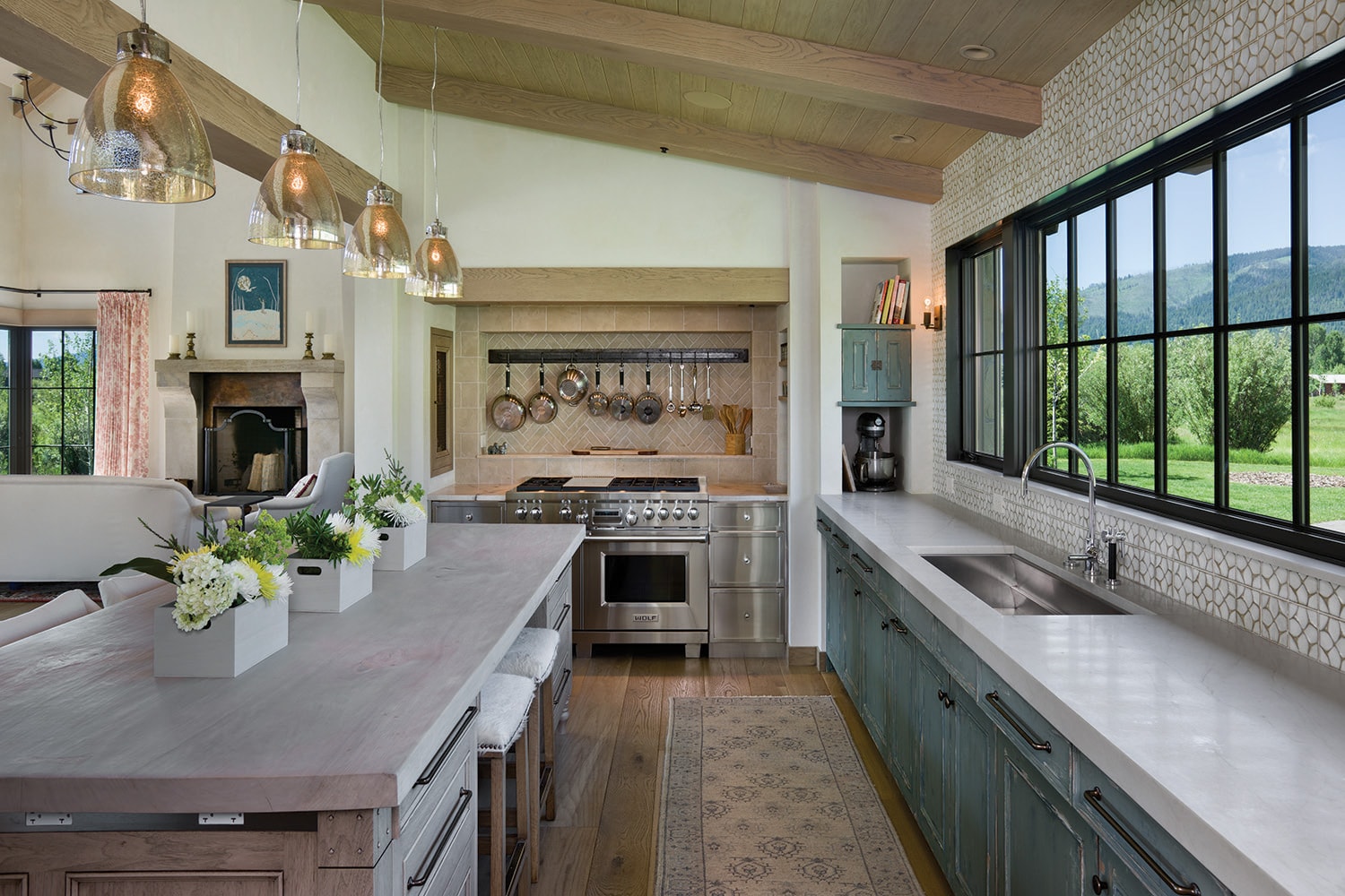 The kitchen features design and cabinetry by de Giulio Design.